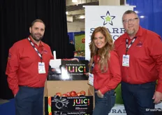 Brett Reasor, Ellie Tucker and Dan Davis with Starr Ranch Growers by the company's Juici apple display. The Juici apple was very popular by show attendees. According to Davis, the response was overwhelming.