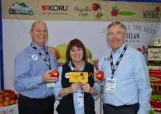 Mac Riggan, Denise Hinkley and Jay Dyer with Chelan Fresh proudly show the SugarBee apple. 