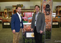 Tyler Tucker and Don Roper of Honeybear Brands, showing of new, soon-to-be-released apple varieties such as First Kiss.