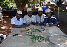 Making the beautiful beaded avocado key rings that delegates received: Willard Charuma, Joseph Kutama, Peter Chivazve and John Kirichi.