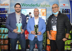 Al Godard, Darren DeFilippis, and Brian DeNova with the Wonderful Company, showing a variety of pistachio products. 