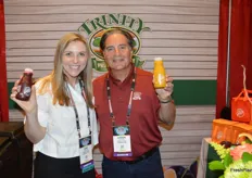 Jeri Elsasser and Levon Ganajian proudly show Trinity's new juices that are made from California grown fruit. 