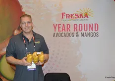 Tom Hall with Freska Produce shows a club pack of mangos. 