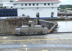 Electric trains carry the ships to keep them in equilibrium. Ships have to move with their own propulsion.