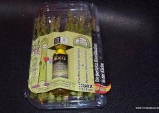 Individual packs of asparagus and olive oil.