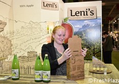 Barbara while she places two bottles of Leni's juice in a practical branded box.