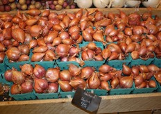 A lot of shallots on the shelf