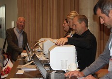 The visitors are welcomed and badges printed.