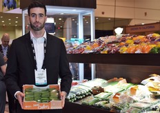 Graham Hamilton of Double Diamond Farms holding a carton of 'mini cukes'