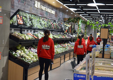 Staff at Hema, Shanghai, are collecting order for online clients. After placing an order online, each clients within a certain area around a Hema store should receive the purchase within 30 minutes, delivered at their door.