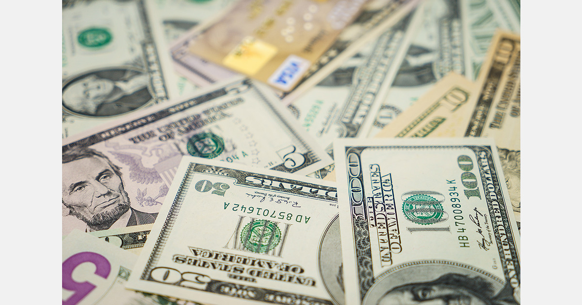 U.S. dollar hits four-year low under policy uncertainty