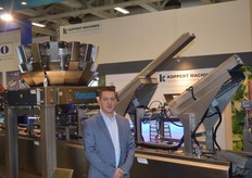 Paul Koppert from Koppert Machines in front of the multipacker. Various trays and bins for snack vegetables can be weighed, filled and packaged. The machine has at its disposal a filling system, a de-nester and a lid machine.