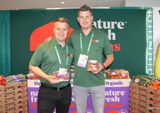 Johnny Neufeld and Niels Peter Klapwijk with Nature Fresh Farms show greenhouse grown strawberries as well as the company's recently launched Hiiros tomato variety. 