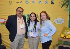 Alberto Pena, Audee Rios, and Aracely Van Dine with Coliman have organic bananas and papayas on display in their booth. 