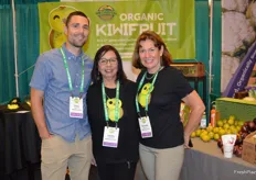 Travis Noland, Cecilia Villalobos, and Kathy Noland from Wild River Fruit proudly show the company's organic fruit varieties. 