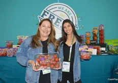 Helen Aquino and Krysten De Giglio with Village Farms are showing sinfully sweet campari tomatoes in clamshell and heavenly villagio marzano tomatoes in a small pouch bag.