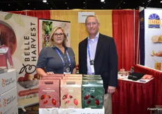 Jennifer Melvin and Milt Fuehrer with Belle Harvest. On display in the booth is a 3 lb. carton for apples. 