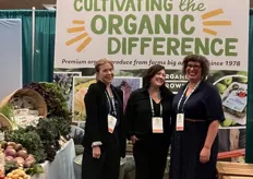 The booth of Organically Grown Company: Sara Parks, Krista Kinder. and Kristi Yoder.