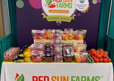 Selection of organic greenhouse grown vegetables on display at the Red Sun Farms booth.