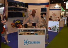 Cemil Kalfazade of Cekaform, promoting their plastic containers. As his photo was about to be taken, he managed to close a deal for a shipment of containers for mushrooms within a mere five minutes.