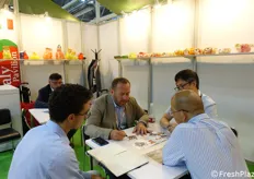 Business meeting at Sorma booth.