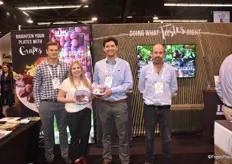 Jakob Smith, Jennifer Woods, Alex Rotan, and Vicente Terragno of HMC Farms, holding their grapeberries, which are the grapes ‘off the stem’ they sell as their main focus.