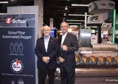 Mike Johnston and Tom C. Muller of Schur Star Systems, displaying their automated bagger machine.