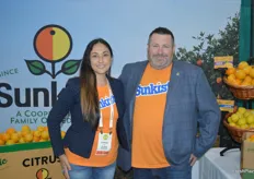 Christina Ward and Christian Harris proudly pose in front of Sunkist's retro logo. The popular lollipop logo was brought back for the company's organic line. 