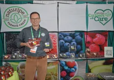 Brian Vertrees with Naturipe Farms has his hands full with raspberries, strawberries and blueberries. 