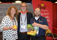 Sara Palmisano, Chuck Zeutenhorst and Lon Hudson with First Fruits Marketing showing Opal apples.