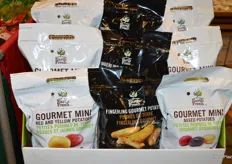 Display with recently launched Gourmet Mini potatoes and Fingerling Gourmet potatoes. The bags are light blocking with product visibility at the bottom. 