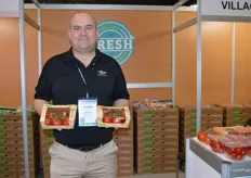 Andrew Sable with Village Farms proudly shows Sensational Sara tomatoes in paper packaging. 